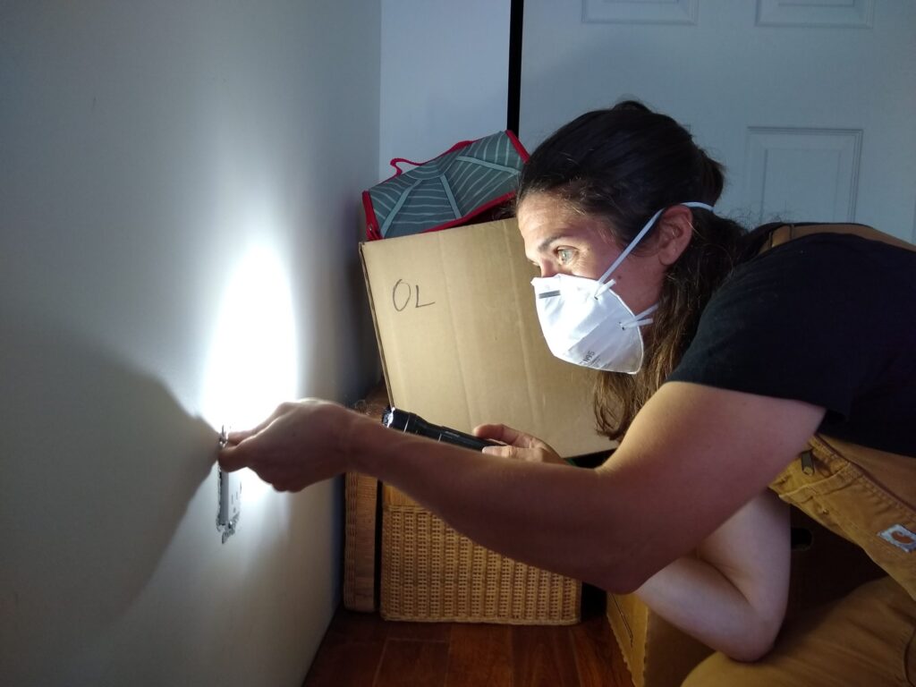 An Energy Advisor conducts a home evaluation