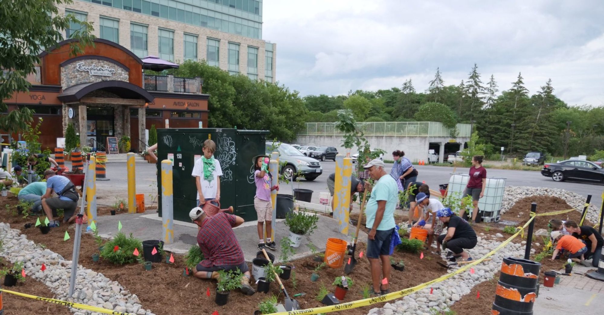 People engaged in planting a green space in a city