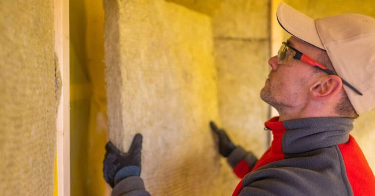 A worker engaged in home insulation