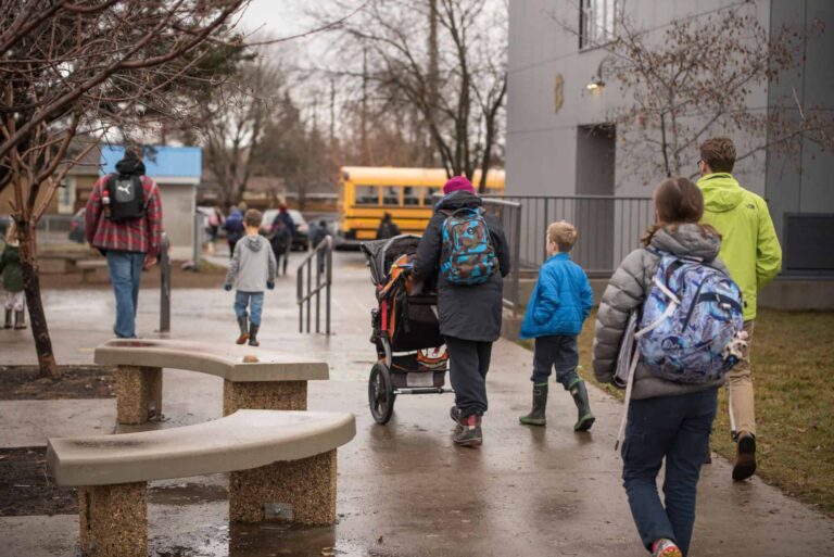 Students accompanied by parents/caregivers walking to school