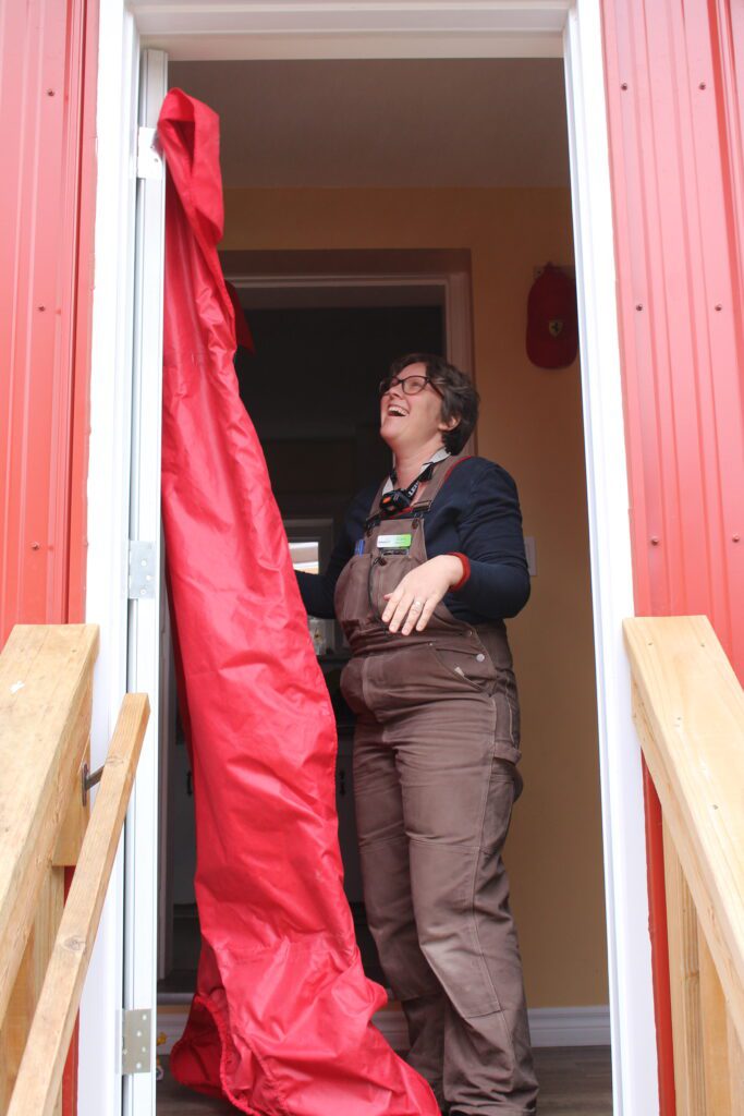 GreenUP energy advisor setting up a blower door test.