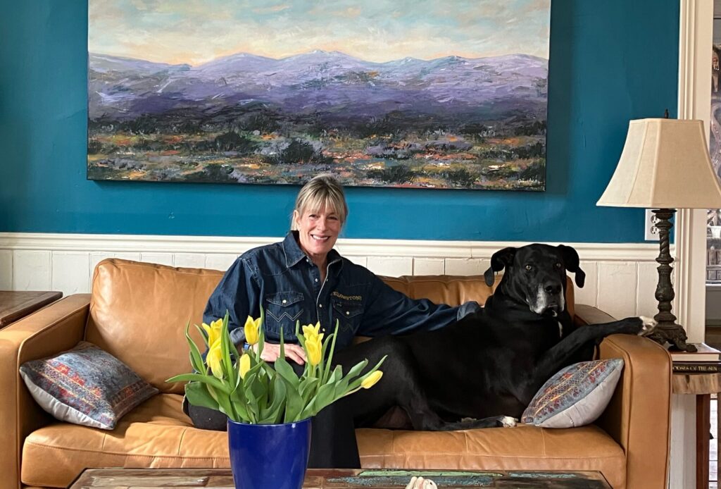 Barb Sheperd enjoying her comfortably cool in the summer and warm in the winter home with her Great Dane, Oliver.