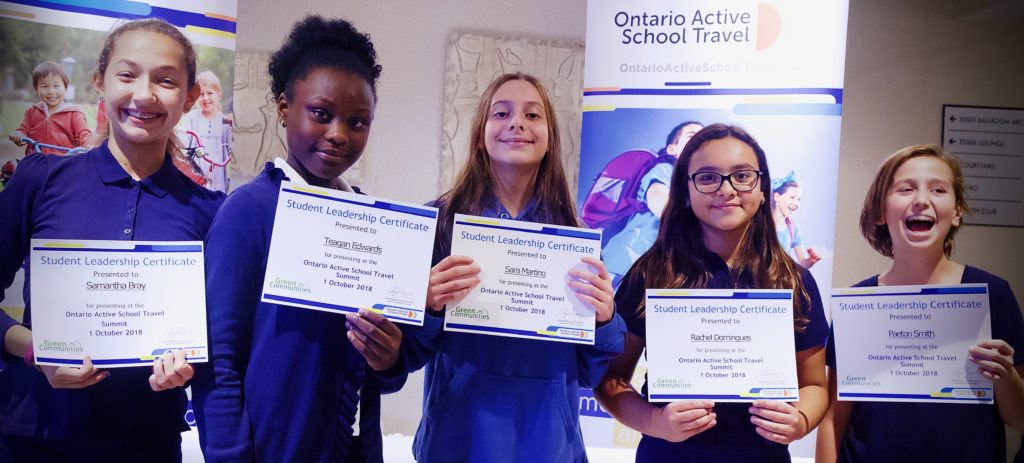 Three students holding Student Leadership Certificates at the Ontario Active School Travel Summit.