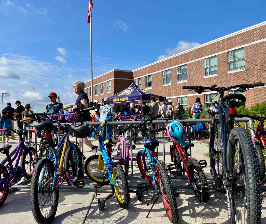 a full bike rack in front of Black Walnut Public School.